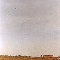 Top left of the photo is a 155mm round in mid-air.